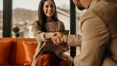 woman shaking mans hand during contract to hire transition