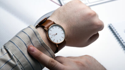 Man checking watch for time left in interim leadership