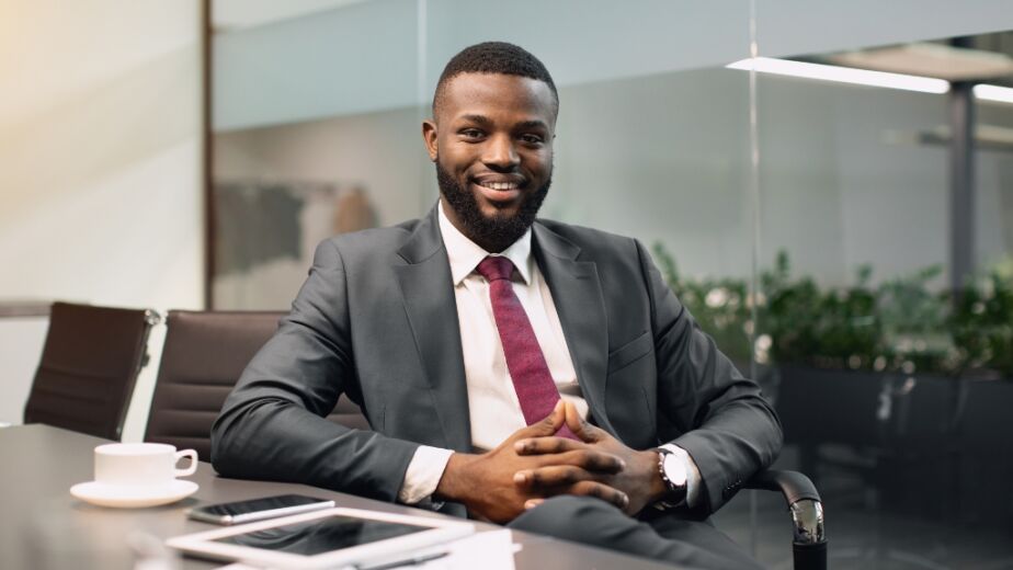 Man sitting at desk during his interim leadership at his temporary role
