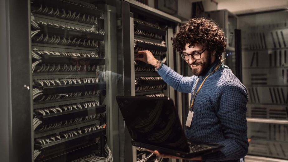 Man working on a server for IT contract jobs