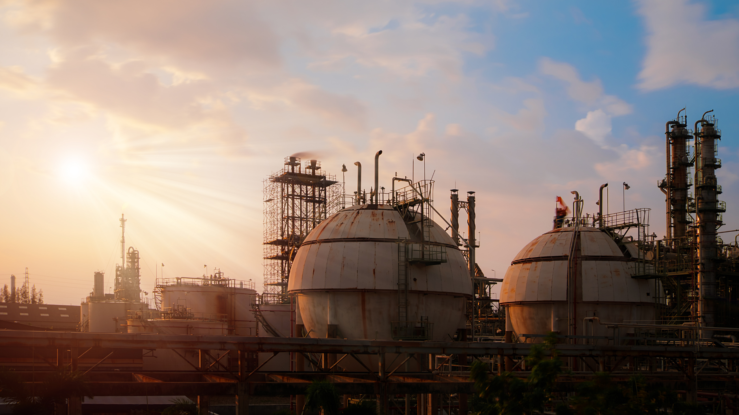 Manufacturing plant in front of hazy sunrise