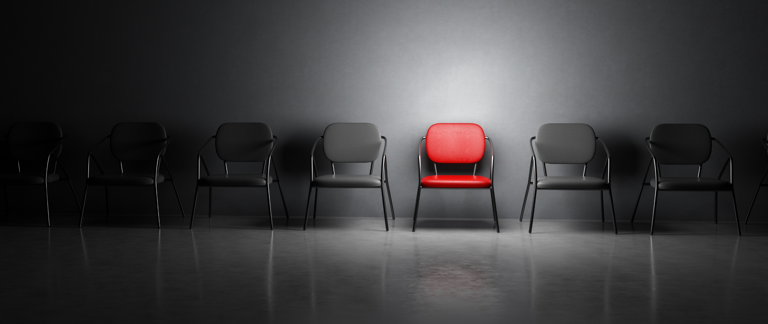 Red chair in line of black chairs, waiting to be filled with contract-to-hire