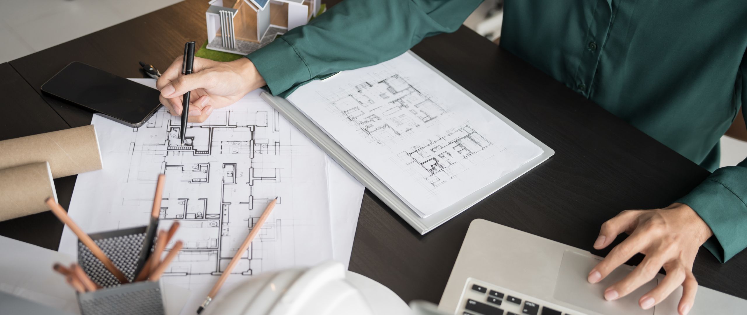 Person preparing blueprints for a statement of work contract staffing search