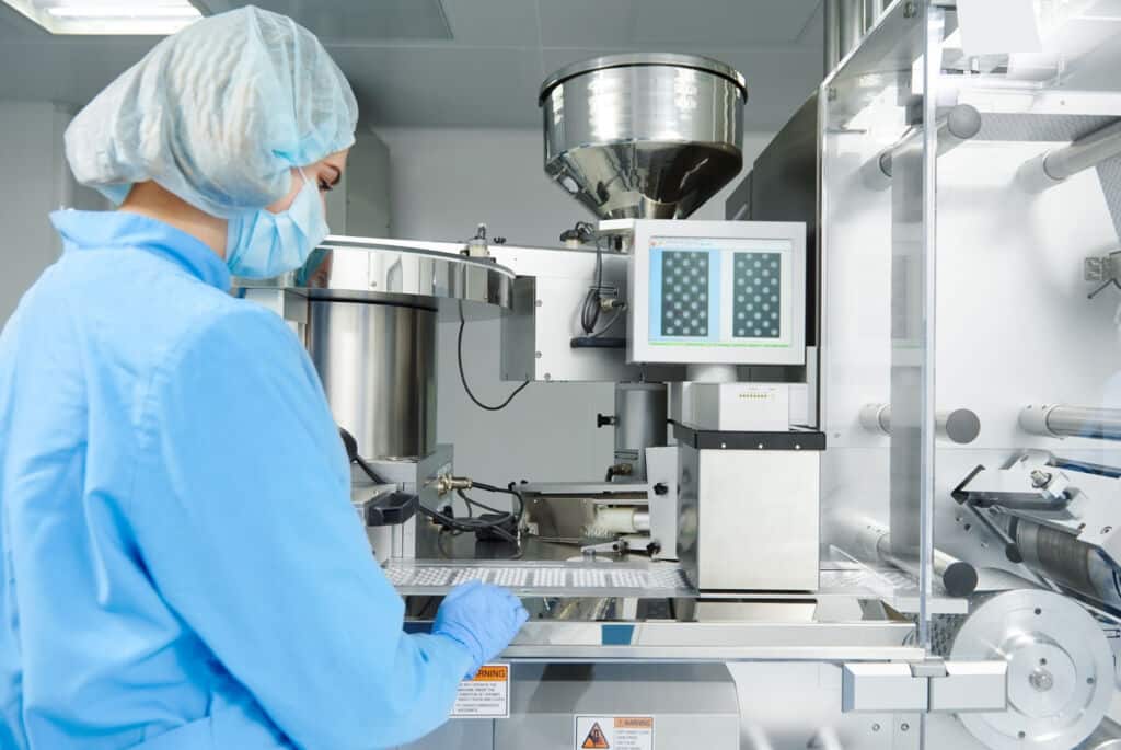 Person working in CMO/CDMO manufacturing environment for life sciences project