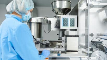 Person working in CMO/CDMO manufacturing environment for life sciences project
