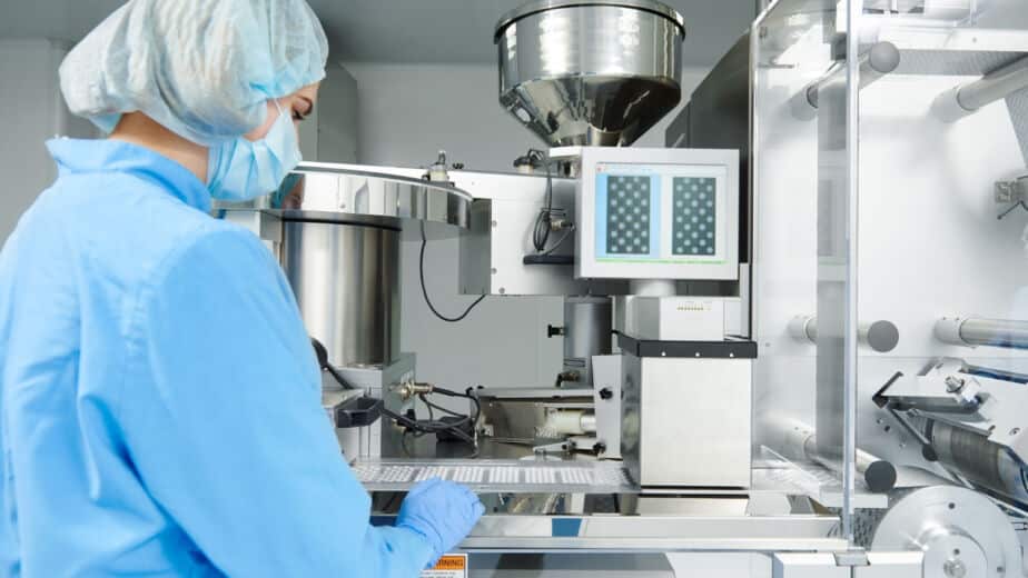 Person working in CMO/CDMO manufacturing environment for life sciences project
