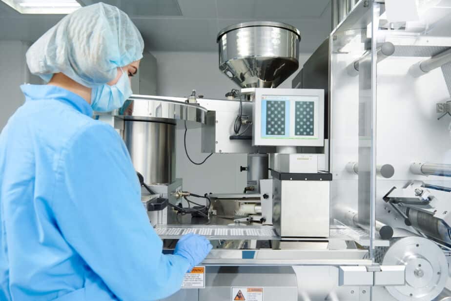 Person working in CMO/CDMO manufacturing environment for life sciences project